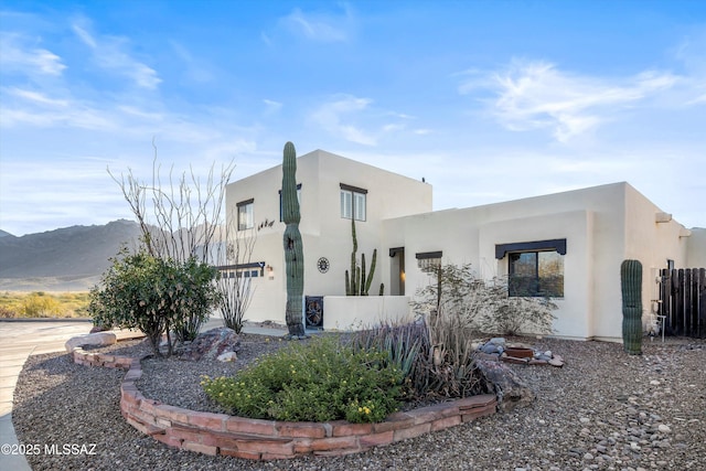 view of property exterior featuring a mountain view