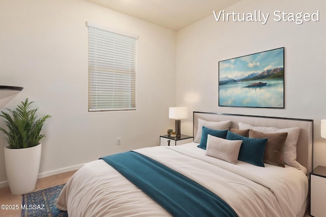 carpeted bedroom with baseboards