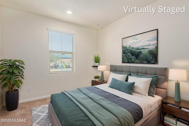 bedroom with baseboards and carpet floors