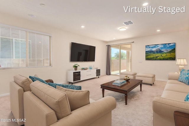 living room featuring baseboards, recessed lighting, visible vents, and light carpet