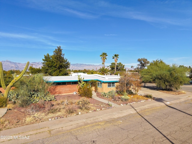 view of front of home featuring a mountain view