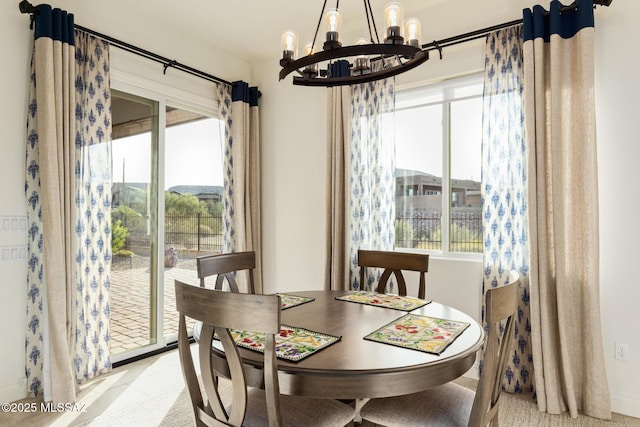 dining space featuring a notable chandelier