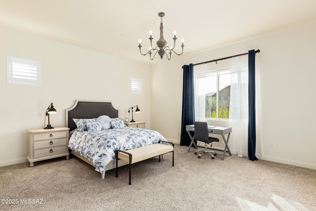 carpeted bedroom with a notable chandelier