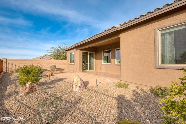 rear view of property featuring a patio