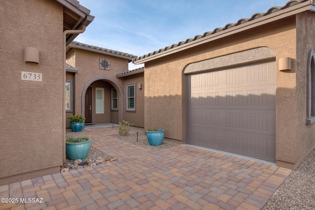 property entrance featuring a garage