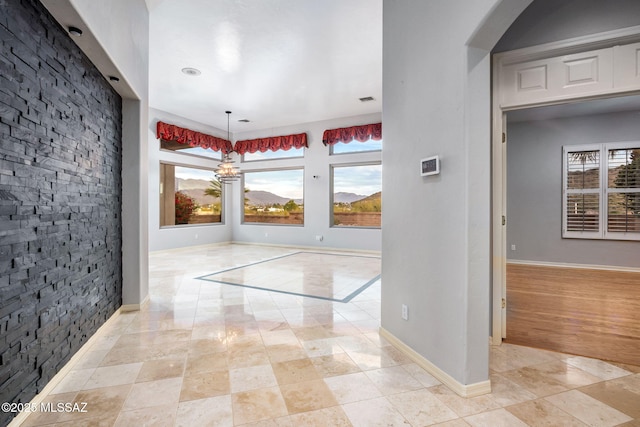 entrance foyer featuring a notable chandelier