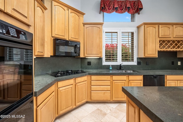 kitchen with black appliances, backsplash, a healthy amount of sunlight, and sink