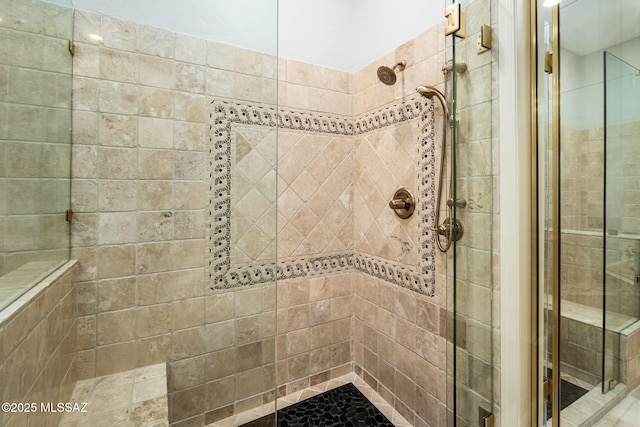 bathroom with tiled shower