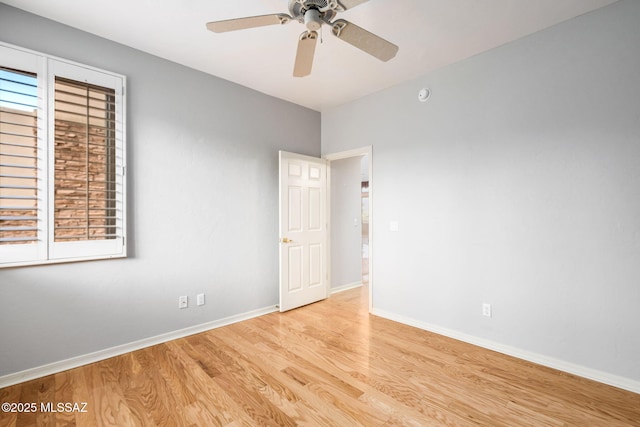 unfurnished room featuring light hardwood / wood-style floors and ceiling fan