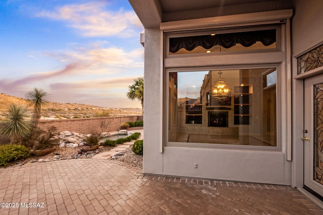 view of patio terrace at dusk