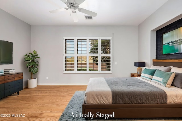 bedroom featuring light hardwood / wood-style floors and ceiling fan