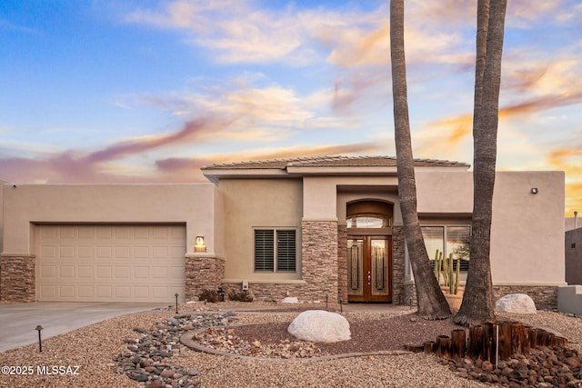 view of front of property with a garage