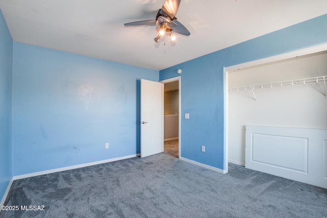 unfurnished bedroom featuring ceiling fan, dark carpet, and a closet