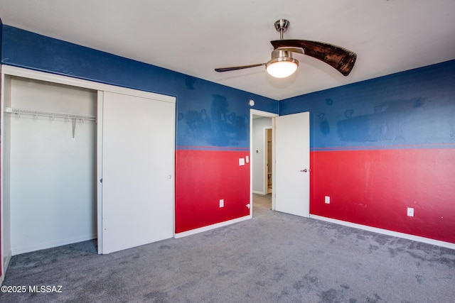 unfurnished bedroom featuring carpet floors, a closet, and ceiling fan