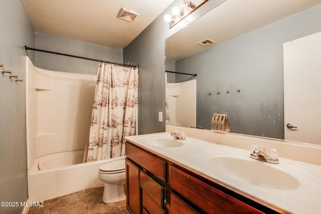 full bathroom with vanity, shower / tub combo with curtain, and toilet