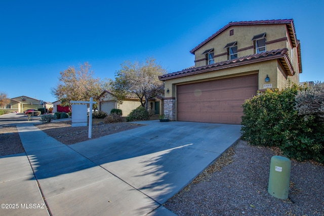 mediterranean / spanish-style home with a garage