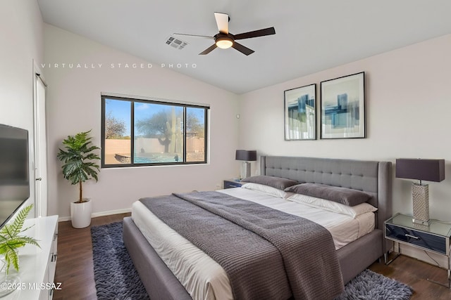 bedroom featuring vaulted ceiling, dark wood-type flooring, and ceiling fan