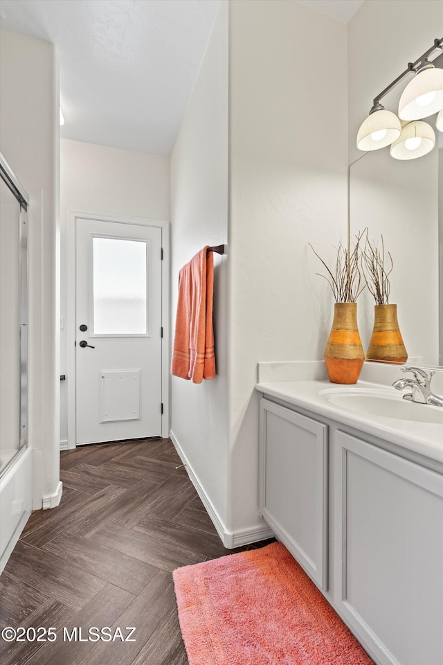 interior space with sink and dark parquet floors