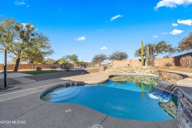 view of swimming pool with pool water feature