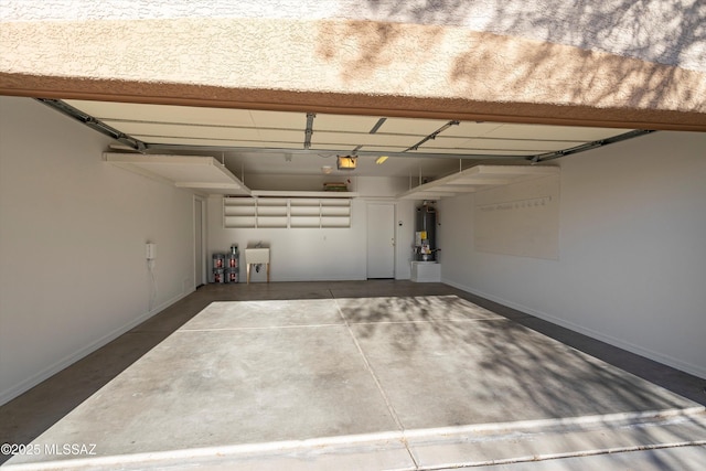 garage featuring a garage door opener and sink