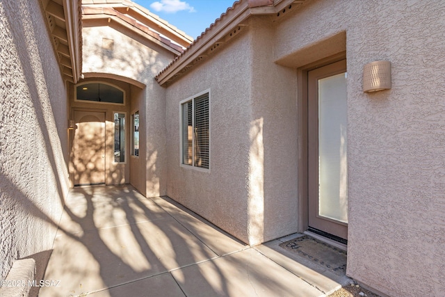 doorway to property featuring a patio area