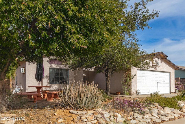 view of side of property featuring a garage