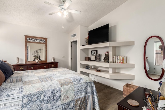 bedroom with lofted ceiling, a textured ceiling, ceiling fan, and dark hardwood / wood-style floors