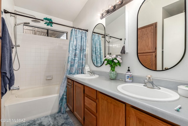 bathroom with shower / tub combo with curtain and vanity