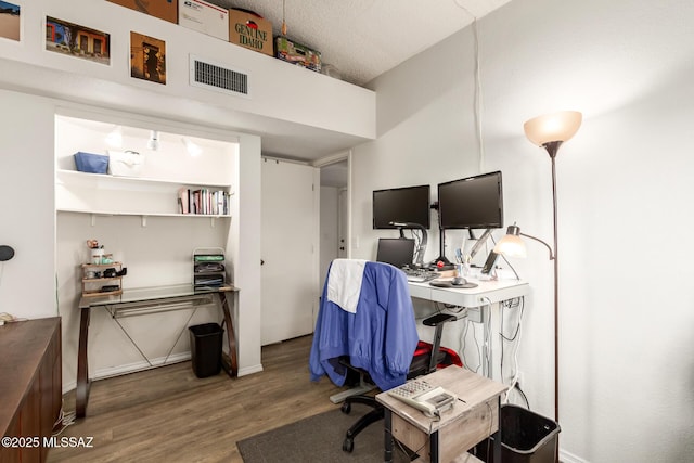 office space with hardwood / wood-style flooring and a textured ceiling