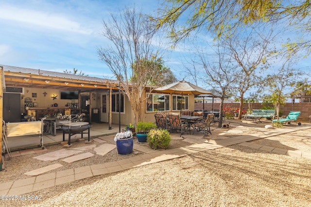 rear view of house featuring a patio