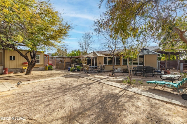 rear view of property with a patio