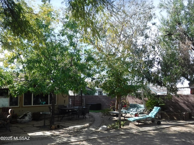 obstructed view of property with a patio area