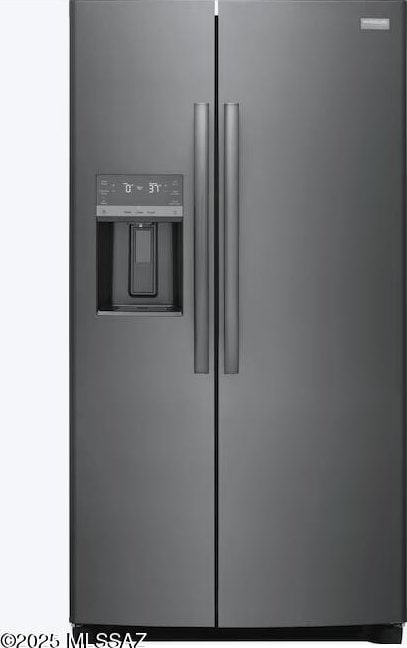 details featuring stainless steel fridge with ice dispenser