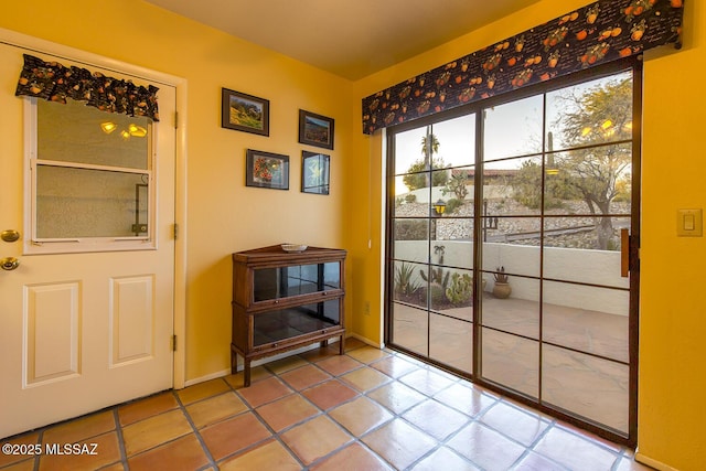 entryway with tile patterned floors