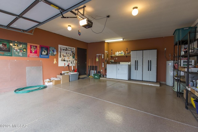 garage with independent washer and dryer, a garage door opener, and water heater