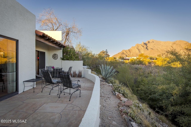 view of patio / terrace with a mountain view