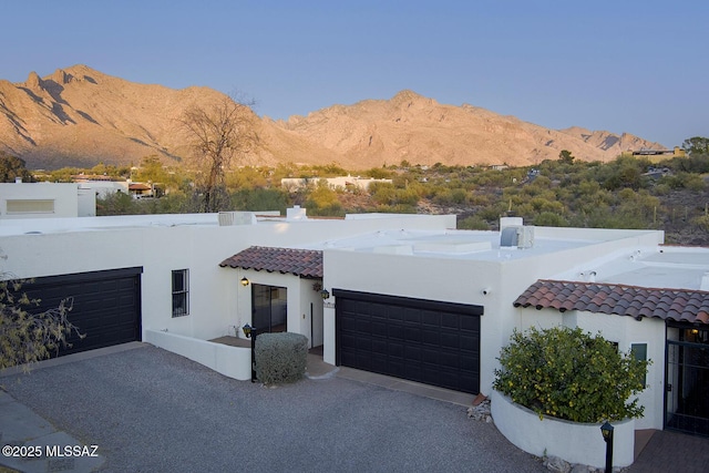 mediterranean / spanish-style house with a mountain view