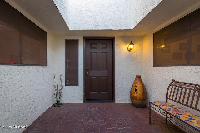 doorway to property featuring a patio area