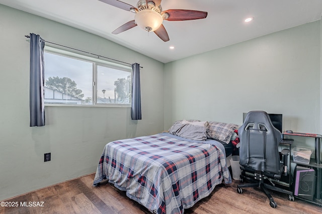 bedroom featuring hardwood / wood-style floors and ceiling fan