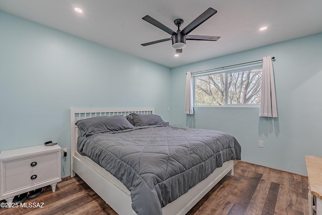 bedroom featuring ceiling fan and dark hardwood / wood-style floors