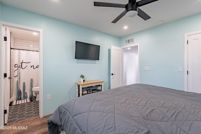 bedroom featuring connected bathroom, ceiling fan, and wood-type flooring