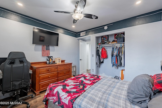 bedroom featuring a closet, ceiling fan, and hardwood / wood-style flooring