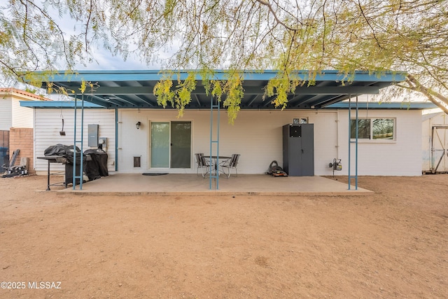 rear view of house featuring a patio