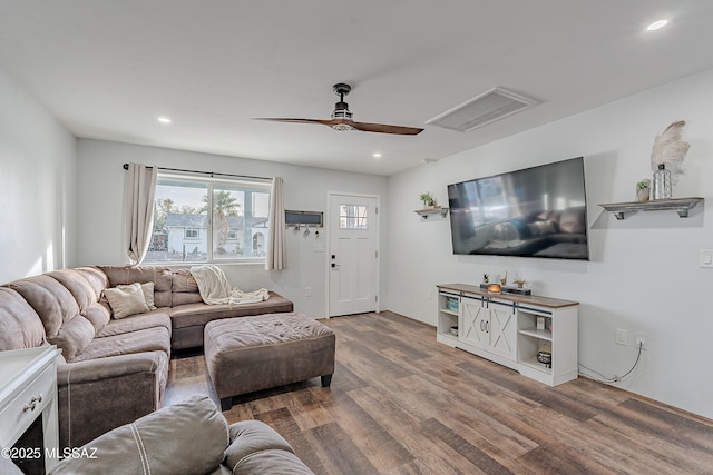 living room with ceiling fan and wood-type flooring