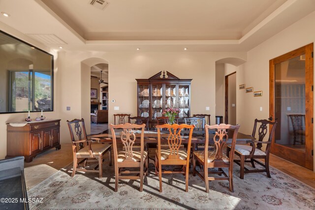 dining space featuring a tray ceiling