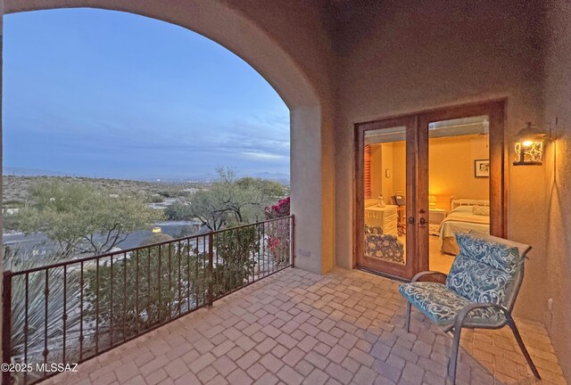 balcony featuring french doors