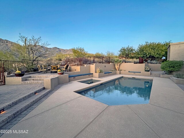 view of patio with ceiling fan, exterior kitchen, a grill, and a fenced in pool