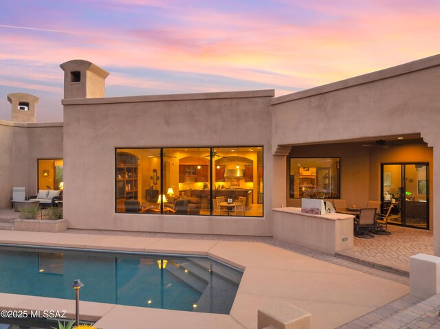 view of patio with an outdoor fire pit and a mountain view