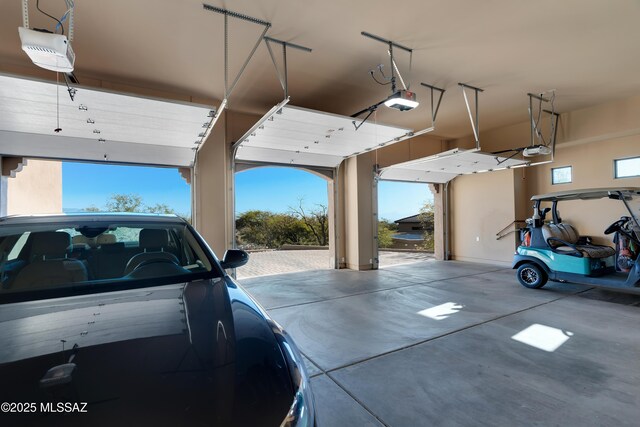 garage featuring a garage door opener