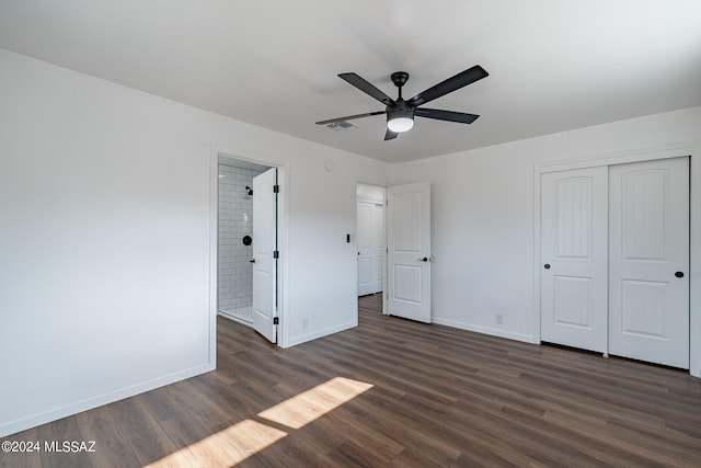 unfurnished bedroom featuring a closet, ceiling fan, and dark wood-type flooring